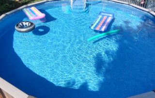 Above ground pool with floats inside.